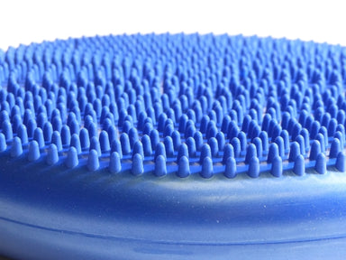 Round blue plastic cushion filled with air, with bumpy sides for grip and massage use.  For standing on to improve balance, stability and core strength